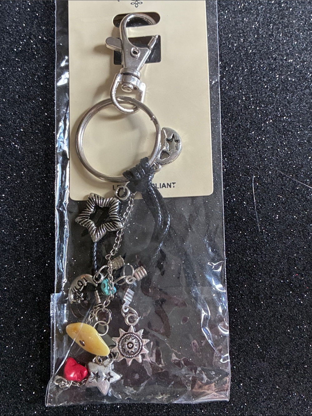 Women's Black Star Charm Keychain with Yellow & Red Accents